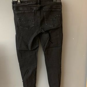 Black American Eagle jeans.